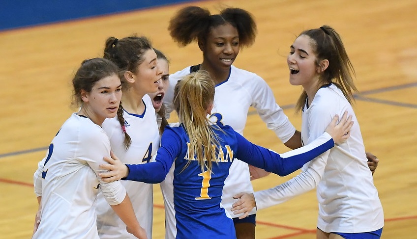 Sarafa, far right, celebrates a point with her teammates during the championship match win. 