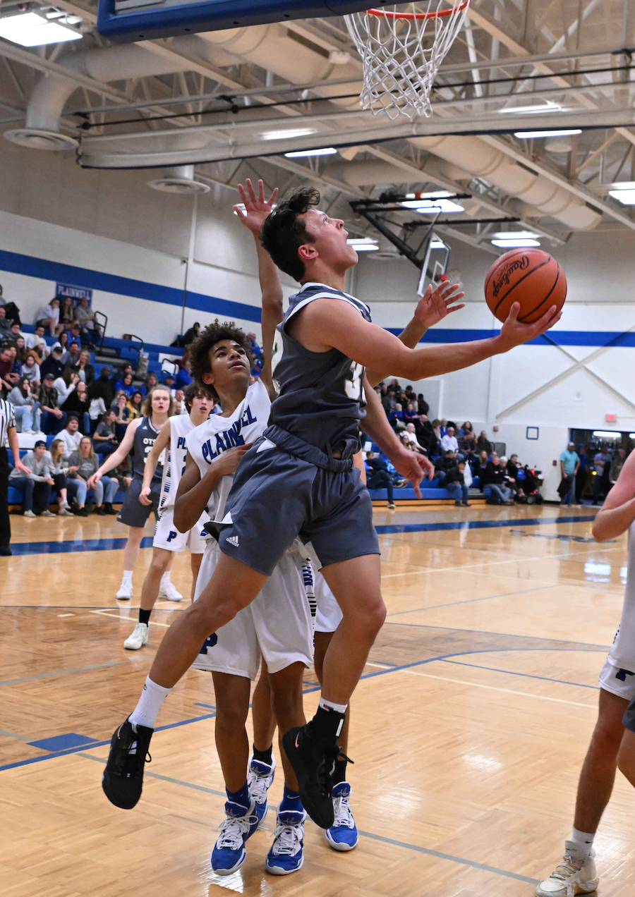 Otsego’s Nicholas Lopez tries for a reverse lay-up during his team’s 63-36 win over Plainwell on Friday.