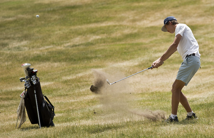 Norway's Carson Chartier chips toward the green at Oak Crest. 