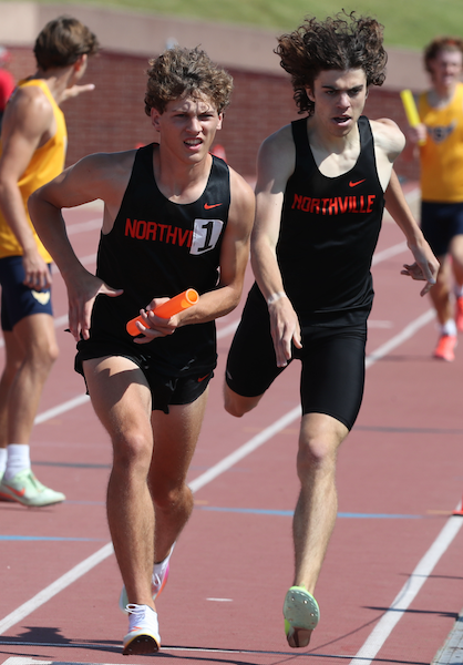 Northville makes the final exchange of its record-setting 3,200 relay. 