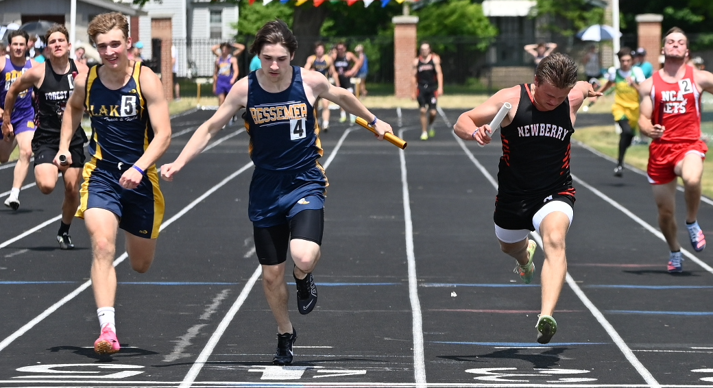 Bessemer's Vinnie Triggiano is able to hold off Lake Linden-Hubbell's Matthew Jokela and Newberry's Kennedy Depew to win the 400 relay.