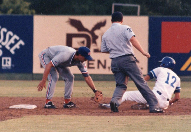 Gates makes a tag at second base while playing for the national team.