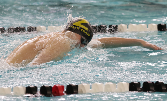 Zeeland’s Owen Stevens swims to the win in the 500 freestyle. 