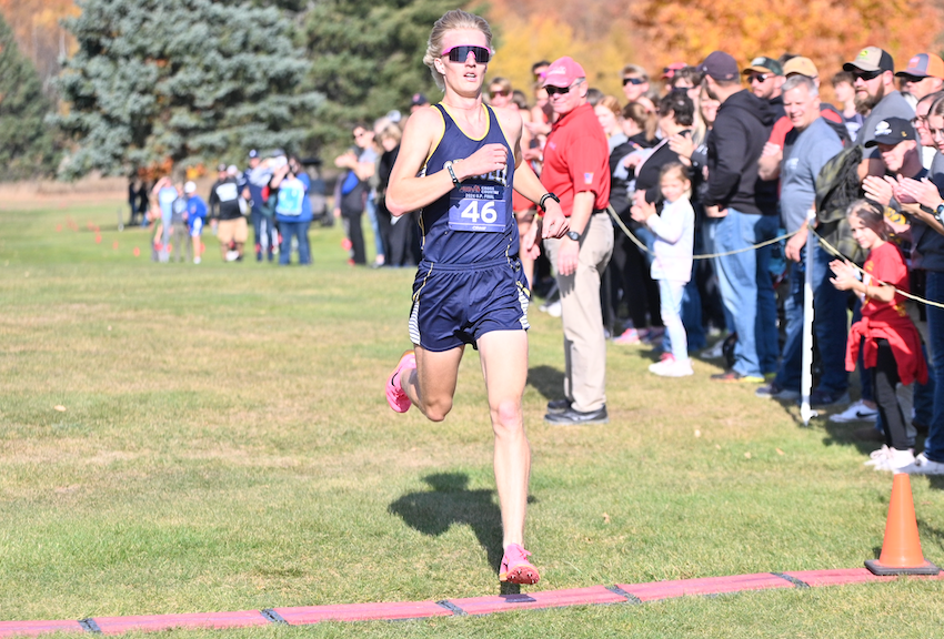 Chassell's Kalvin Kytta crosses the finish line first in the Division 3 race at Pictured Rocks Golf Course in Munising. 