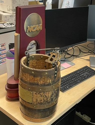 A pair of beloved trophies sit temporarily on Person’s desk at Purdue.