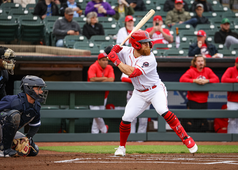 Dunn stands in for a pitch playing for the Louisville Bats this season.