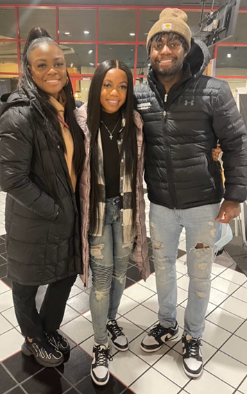 Jordan Walker, middle, takes a photo with sister Jasmyn and brother Jarvis. 