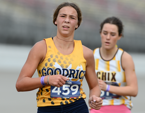 The Martians’ Baylor Lauinger and Zeeland East’s Meredith Cook charge toward the finish. 