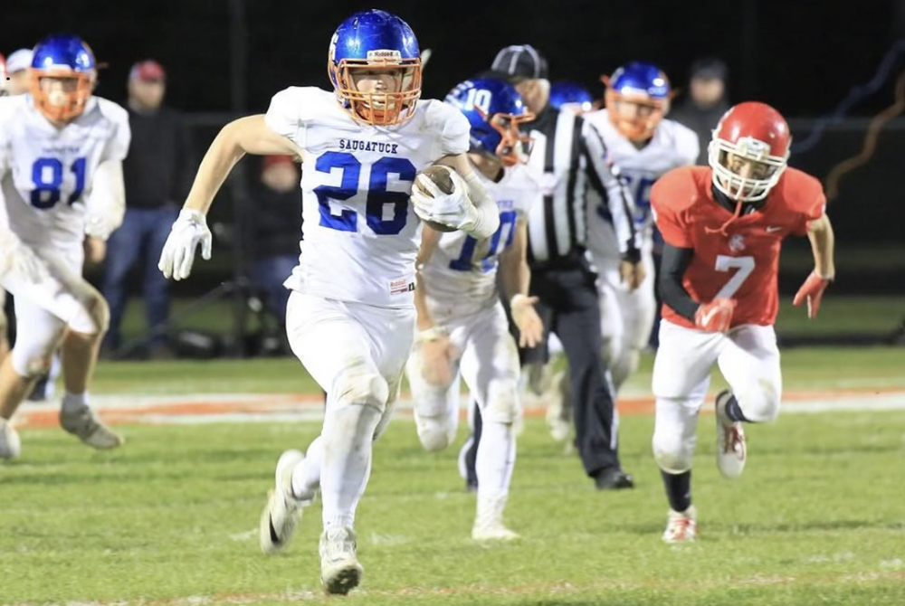 Saugatuck's Nick Stanberry breaks away for a 99-yard TD run against Kent City in 2018.