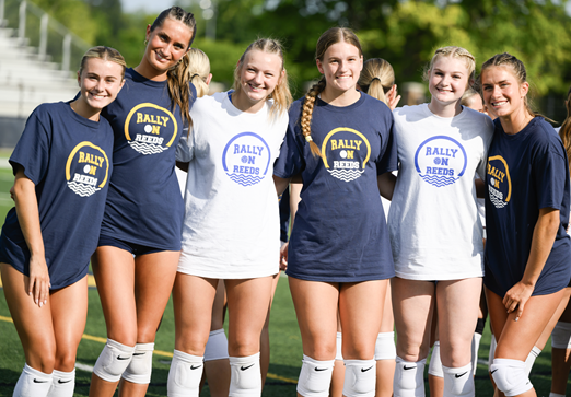 East Grand Rapids and Hopkins players take a photo together wearing their “Rally on Reeds” shirts.