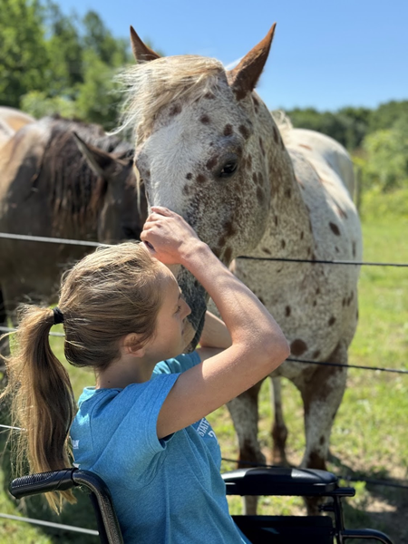 Smith shares a moment with her horse.