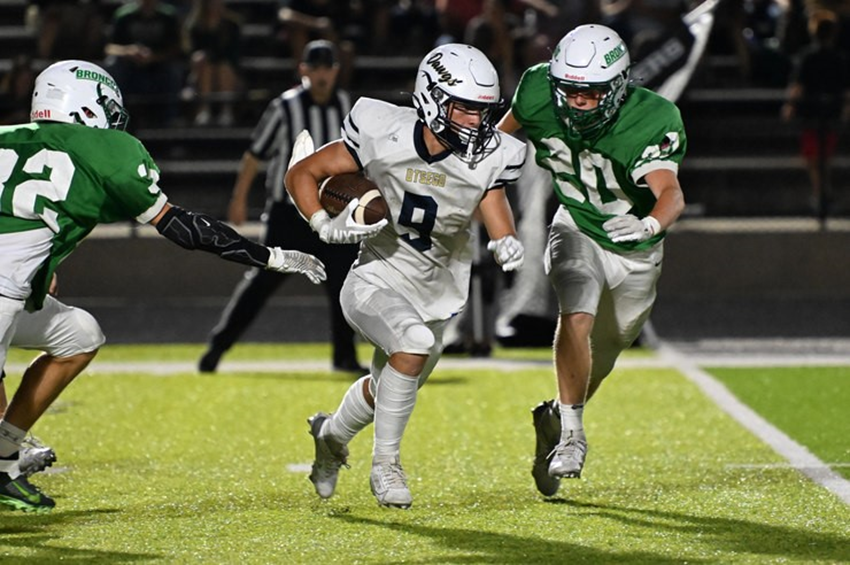 Otsego's Lane Blanchard breaks through an opening during his team's loss to Coopersville.