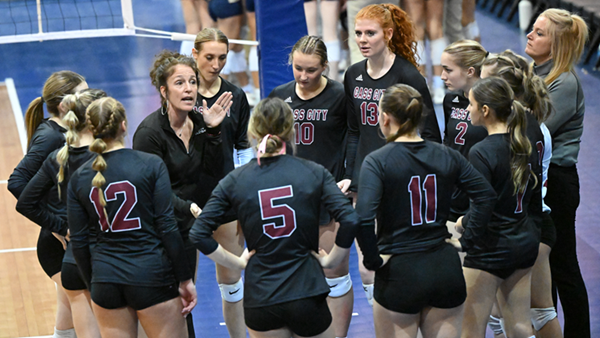 Red Hawks coach Amy Cuthrell talks things over with her team during that match at Kellogg Arena.