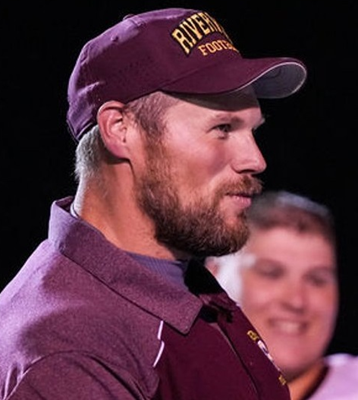 Pirates coach Derek McLaughlin shares a moment with his team.