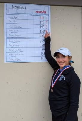 O’Grady points out her score, which tied for second among individual competitors.