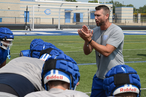 Carlson coach Jason Gendron pumps up his team during a practice.