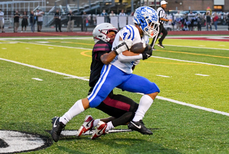 The Marauders’ Avery Ortiz drags a defender downfield. 