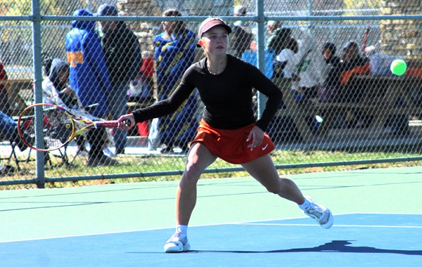 Escanaba’s Maggie Martin prepares to connect during a No. 1 singles match.