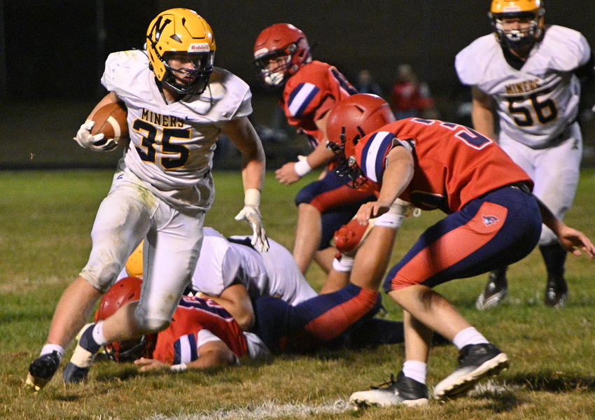 Negaunee's Hank Tincknell (35) gets read to take on an Ishpeming Westwood defender.Negaunee's Hank Tincknell (35) gets read to take on an Ishpeming Westwood defender.