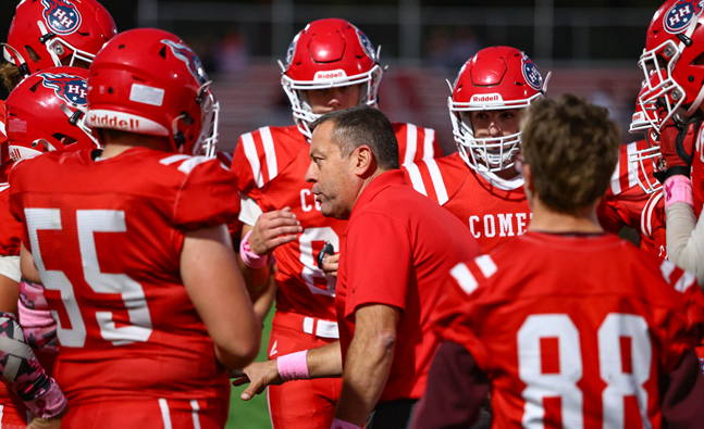 Comets coach David Messer talks things over with his players.