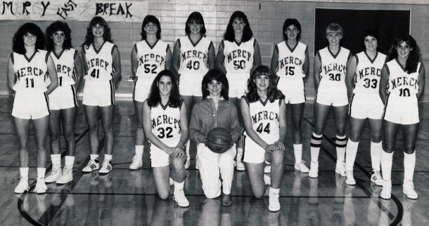 Members of the 1982 Farmington Hills Mercy girls basketball team pose for a team photo.