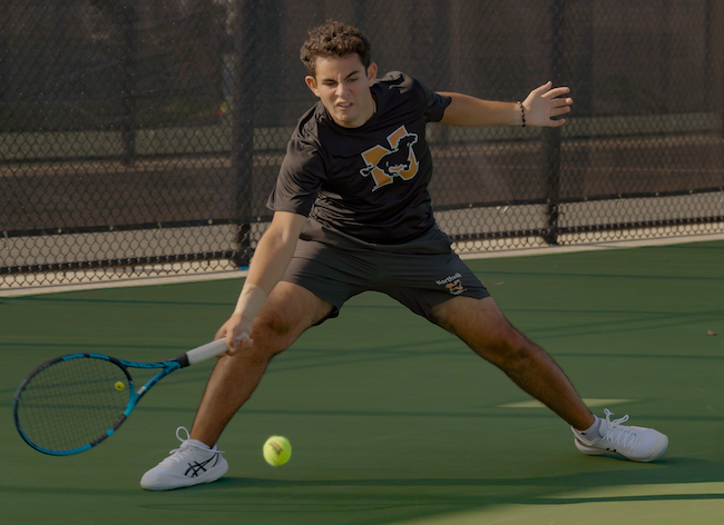 Northville’s Alex Boules gets into a ground stroke at No. 4 singles Friday.