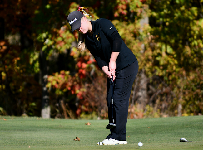 Farmington Hills Mercy’s Macy Morphew watches one of her putts roll toward the hole.