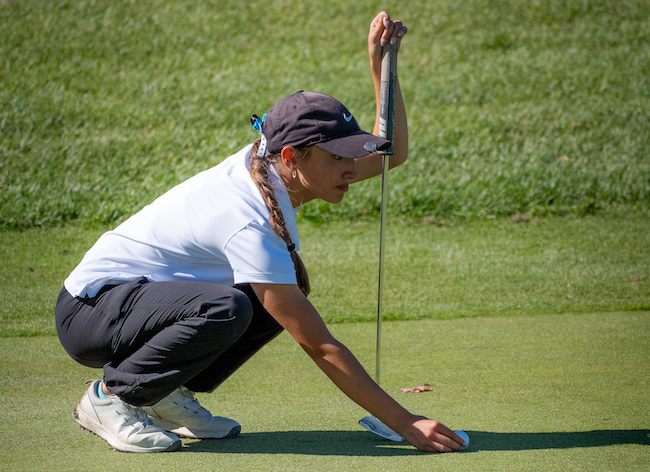 Grand Rapids Christian’s Lillian O’Grady lines up a putt.