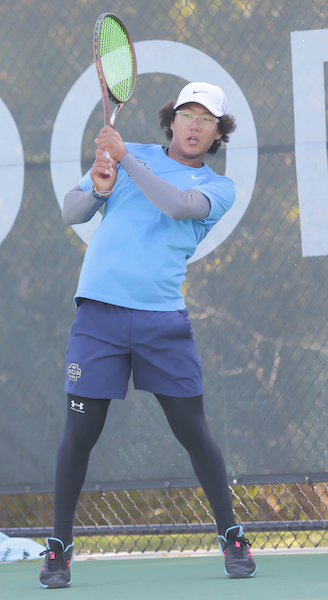 Country Day’s Ricky Jeong volleys during his No. 3 singles title match.