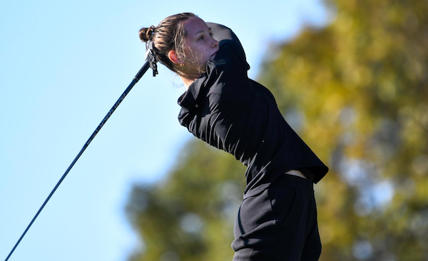 Kalamazoo Christian’s Scarlett Hindbaugh watches the flight of one of her shots.