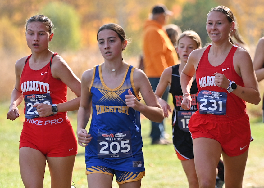 Marquette's Maija Maki-Warne (223), Kingsford's Maria Murvich (205) and Marquette's Ella Fure (231) run together during the beginning of the Division 1 race.