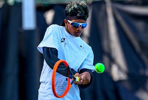 Forest Hills Northern's Vikram Krishnan sends a forehand at No. 3 singles.