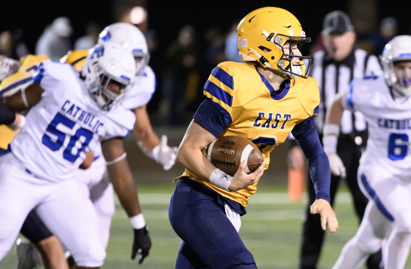 East Grand Rapids’ Carson Thornton (8) finds a gap in the Grand Rapids Catholic Central defense.