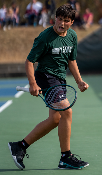 Grand Rapids West Catholic’s Oliver Caldwell shows intensity during a No. 1 singles match.