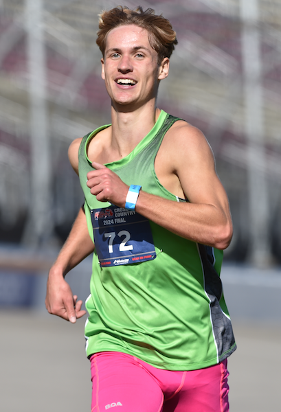 Jenison’s Seth Conner sees the finish line ahead as he leads the Division 1 Final. 