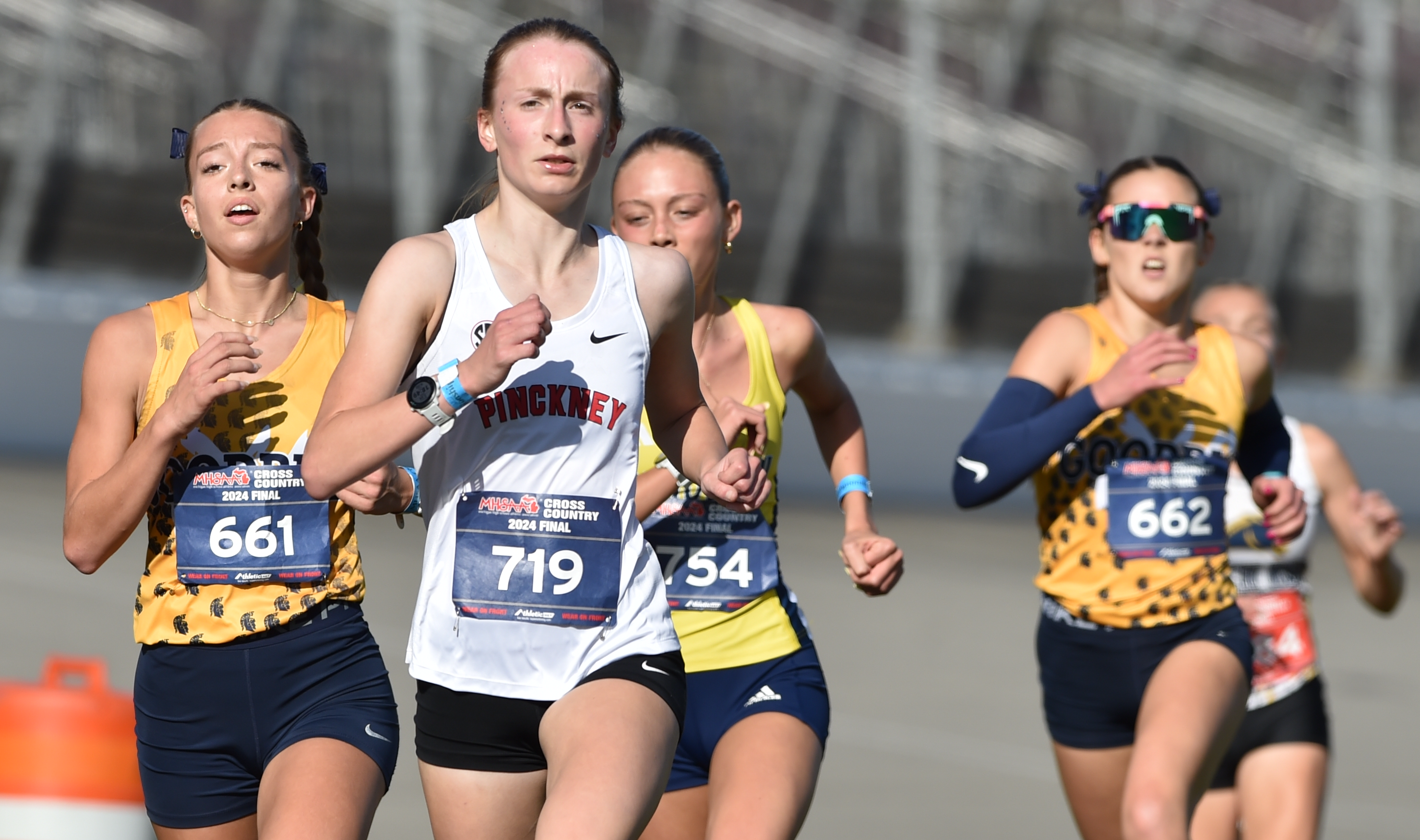 Goodrich’s Avery Byrne (661) and Layla Jordan (662) run in a pack that also included Pinckney’s Madalynn Karsies (719).