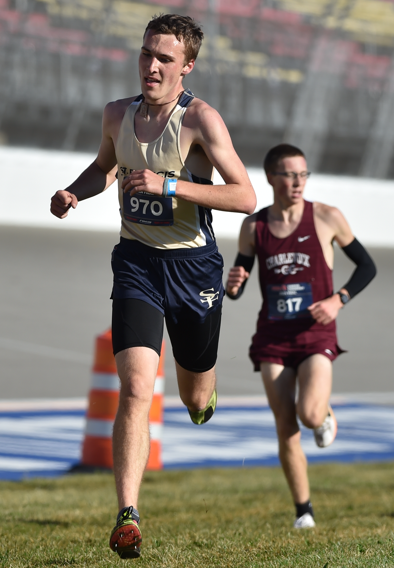 Riley Pattinson (970) emerges from a pack to lead St. Francis’ finishers. 