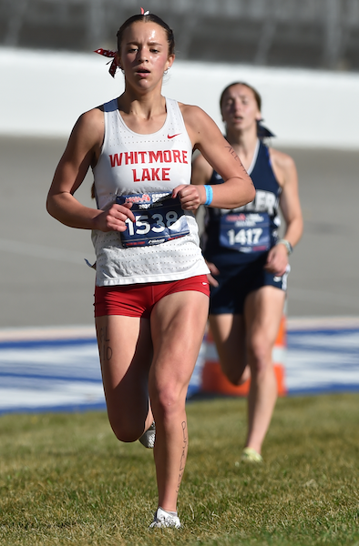 Elodie Weaver (1538) pushes through the final stretch on the way to crossing the line third for Whitmore Lake.