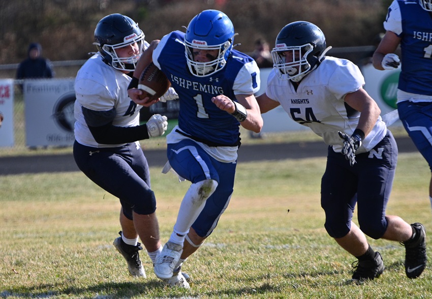  Ishpeming's Caden Luoma breaks away from Norway's Carter Cazzola (43) and Keith Burar, Jr. (54). 