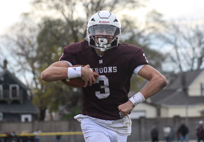 Menominee junior Tanner Theuerkauf celebrates a touchdown against the Gladiators.