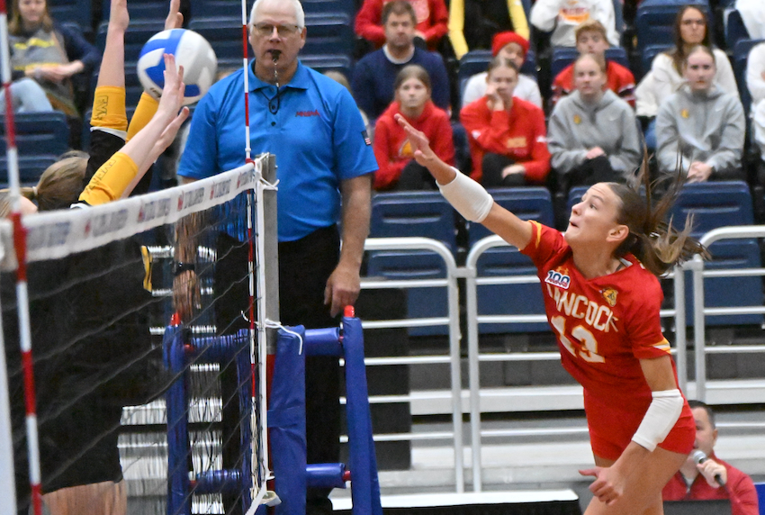 Hancock’s Brooke Koskela (13) puts a ball through an Everest block. Koskela finished with 10 kills for the Gremlins (25-7-2).