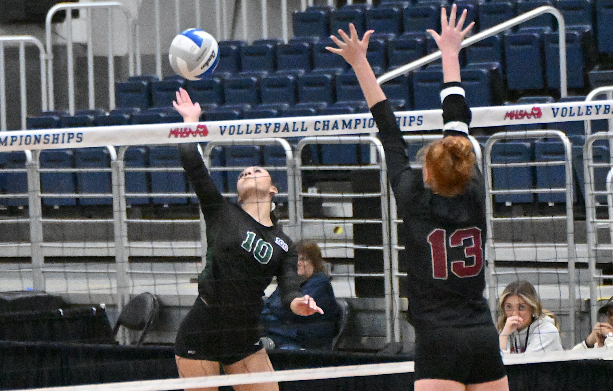 Monroe St. Mary Catholic Central’s Felicity Mugler winds up for a kill attempt with Cass City’s Shelby Ignash putting up a block in their Division 3 Semifinal. Mugler had eight kills in the 25-12, 25-21, 23-25, 25-21 victory, and Ignash finished with 22 kills and four blocks.