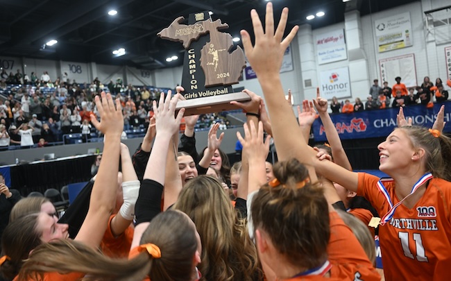 Northville players raise their championship trophy. 