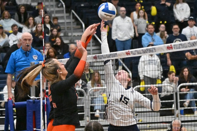 The Yellowjackets’ Payton Woodruff (15) and a pair of Tecumseh blockers contend for the ball. 