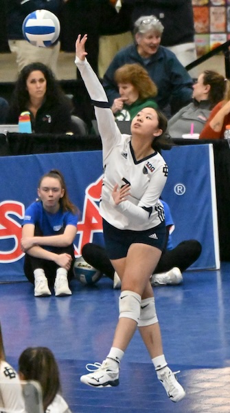 Country Day’s Grace Lu launches a serve. 