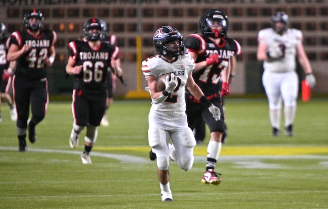 Morrice’s Joel Fisher (2) breaks away from the Forest Park defense for a long second-half touchdown run. 