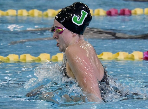 A Jenison swimmer competes during the 200 medley relay.