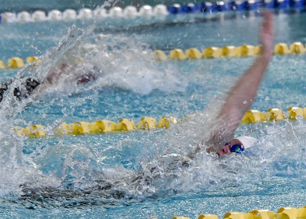 Racers power through the backstroke Saturday. 