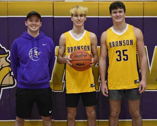 Vikings head boys basketball coach Damien Loveless, left, is joined by his two returning four-year senior standouts Brackett (middle) and Bucklin.