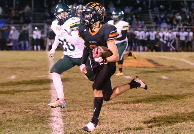 Bills races Napoleon defenders during a District Semifinal win.